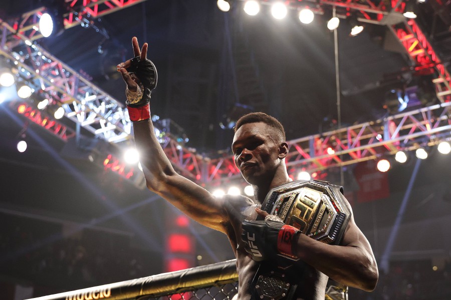 Israel Adesanya celebrates after defending his middleweight championship against Robert Whittaker during UFC 271 at Toyota Center on February 12, 2022 in Houston, Texas. - AFP PIC