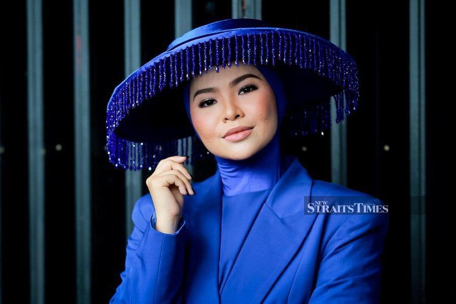 Singer Aina Abdul, basking in the success of her debut album 'Imaji' and a concert attended by 10,000 devoted fans, is gearing up for greater strides in 2024. - NSTP/ASYRAF HAMZAH