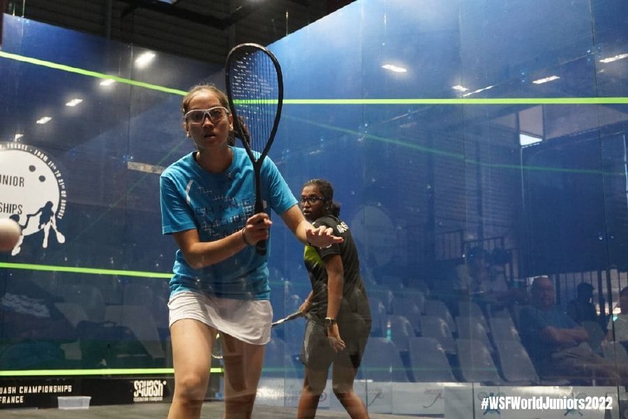 Aira Azman (left) in action against K. Sehveetrraa in the fourth round of the World Junior Championships in France today. - Pic courtesy of SQUASHSITE