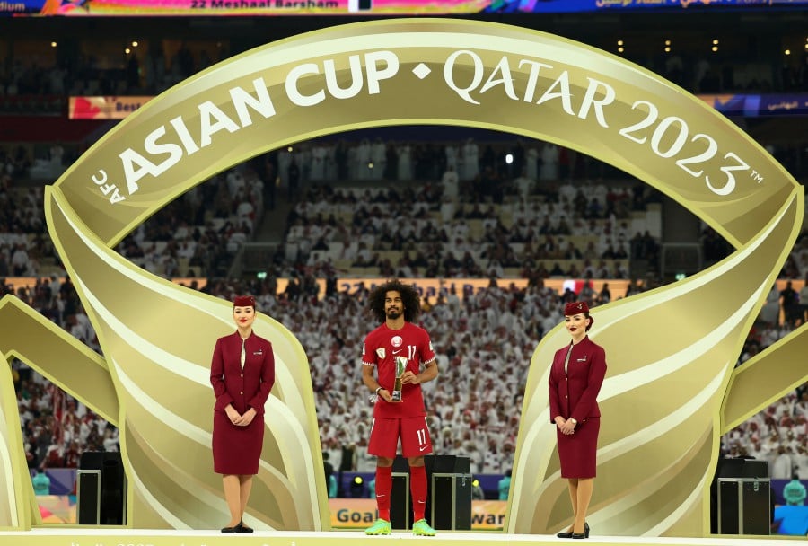 AFC Asian Cup - Final - Jordan v Qatar - Lusail Stadium, Lusail, Qatar - Qatar's Akram Afif celebrates with the trophy for player of the tournament. - Reuters pic