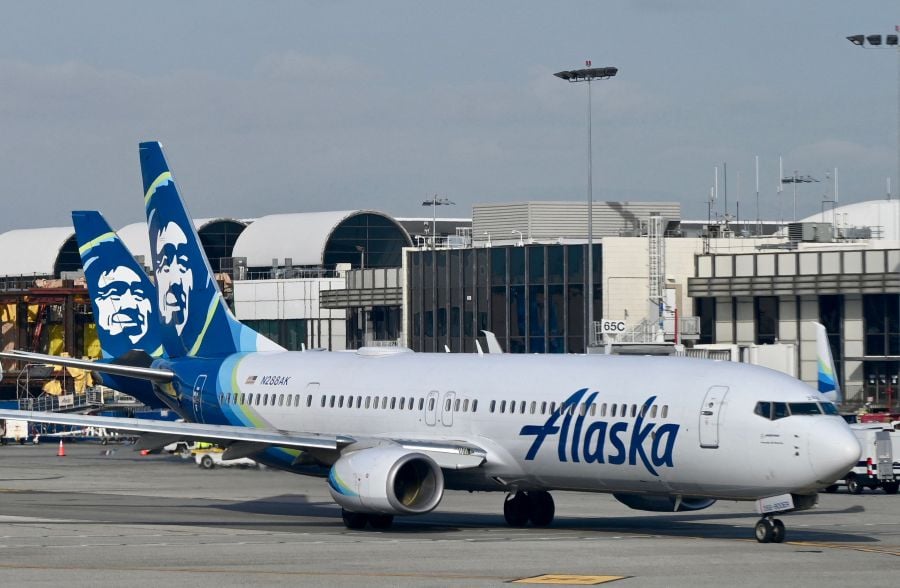 An Alaska Airlines flight with 177 people onboard made an emergency landing in the US state of Oregon on Friday, the airline said, with passengers reporting a plane window panel blown out after takeoff. - AFP file pic