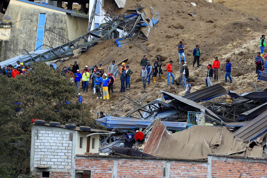 Rescuers search for victims after a landslide in Alausi, Ecuador. - EPA PIC