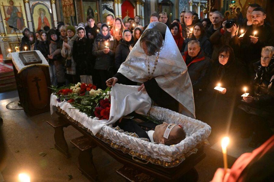 The body of late Russian opposition leader Alexei Navalny is seen during the funeral service at the Mother of God Quench My Sorrows church in Moscow's district of Maryino. - AFP pic