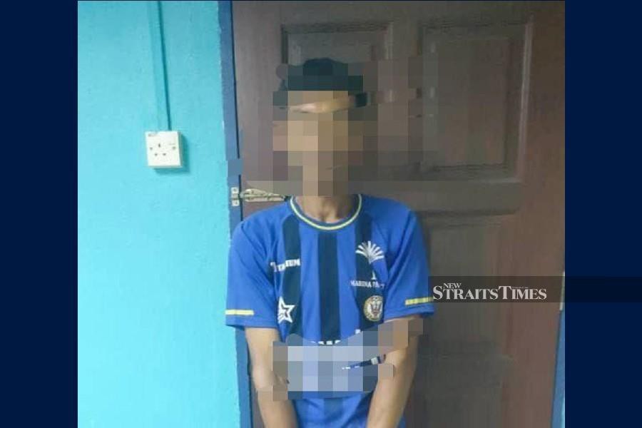 A man was arrested after he ran amok and threatened to kill his cousin's husband using an axe in front of the victim's home in Kampung Nyabut, Trombol, here, last night. - NSTP/ MELVIN JONI