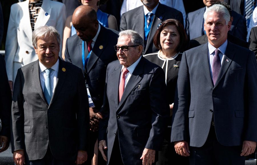 Cuban former President Raul Castro (Centre), Cuban President Miguel Diaz Canel (Right), and United Nations General Secretary Antonio Guterres (Left) pose for a family photo at the G77+China summit in the Convention Palace in Havana on September 15, 2023. The G77+China, a group of developing and emerging countries representing 80 percent of the global population, gathers Friday in Cuba seeking to promote a "new economic world order" amid warnings of growing polarization. - AFP file pic