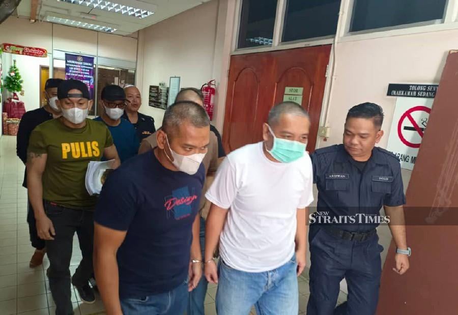 The accused in the e-hailing driver murder case was brought out of the courtroom on the fourth day of the trial today. NSTP/ABDUL RAHEMANG TAIMING