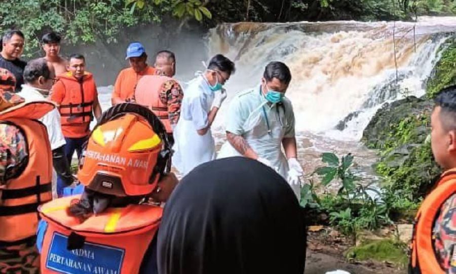 One man died while another is still missing following a water surge incident at a waterfall in Kampung Sebat, Sematan, about 100 km from here, this afternoon. - Courtesy of Sarawak Fire and Rescue Dept