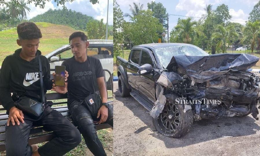 Anif's sons Afiq (left) and Aqiq showed the picture of the Toyota Hilux which killed their father last night. - NSTP/SHARIFAH MAHSINAH ABDULLAH/SYAHERAH MUSTAFA