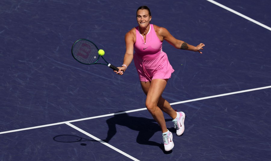 Aryna Sabalenka plays a forehand volley against Emma Raducanu of Great Britain in their third round match during the BNP Paribas Open at Indian Wells Tennis Garden in Indian Wells, California. - AFP pic