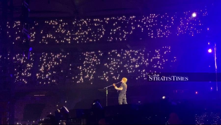Thousands of flash lights were being held high during the concert.