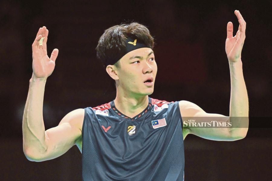 Malaysia's Lee Zii Jia celebrates victory against Japan's Kodai Naraoka in their men's singles final at the Australia Open in Sydney on Sunday. AFP PIC 