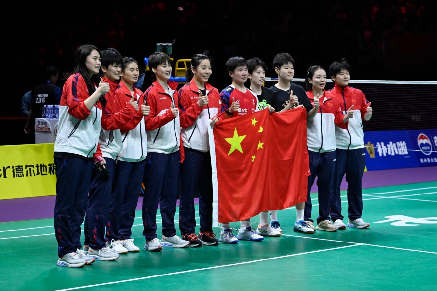 Members of the Chinese women’s badminton team celebrate after winning against Indonesia in the women’s finals of the Thomas and Uber Cup badminton tournament in Chengdu, in China]’s southwest Sichuan province on May 5, 2024. - AFP pic