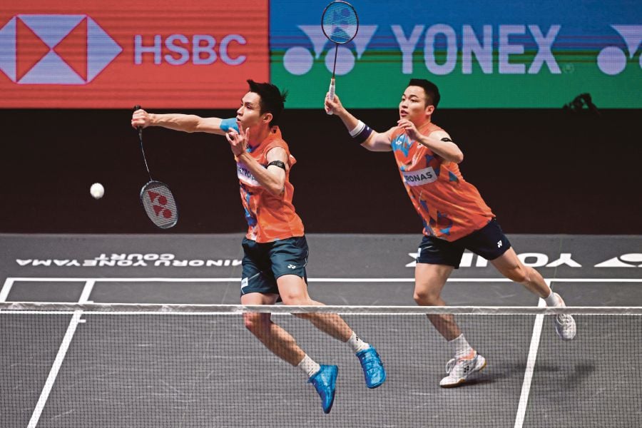 Aaron Chia (R) and Soh Wooi Yik (L) in action against Indonesia's Fajar Alfian and Muhammad Rian Ardianto in the men's doubles final at the All England Championships. AFP Pic