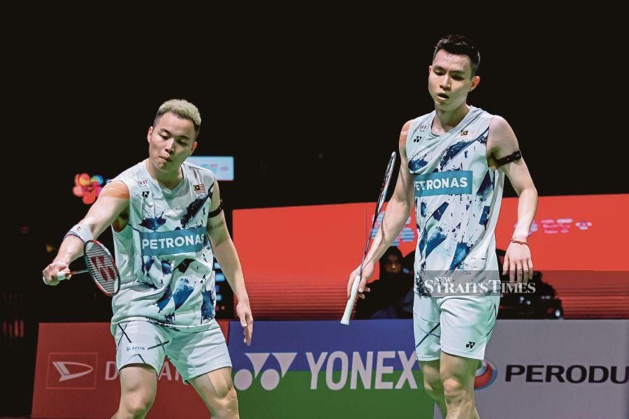 Aaron Chia (left)-Soh Wooi Yik in action during the Malaysia Masters at Axiata Arena, Bukit Jalil on Friday. PIC ASYRAF HAMZAH