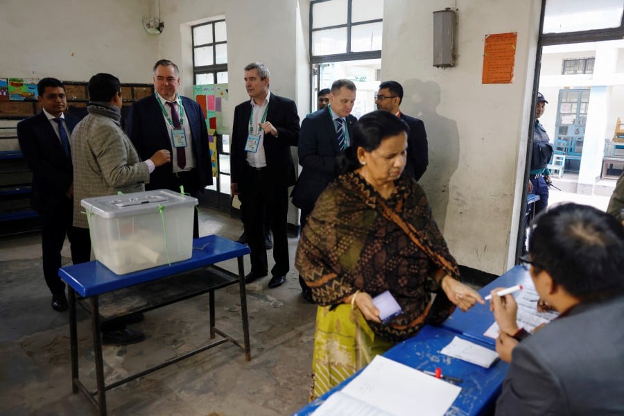 A team of foreign observers from Russia visit a voting center during the 12th general election in Dhaka, Bangladesh, January 7, 2024. - Reuters pic