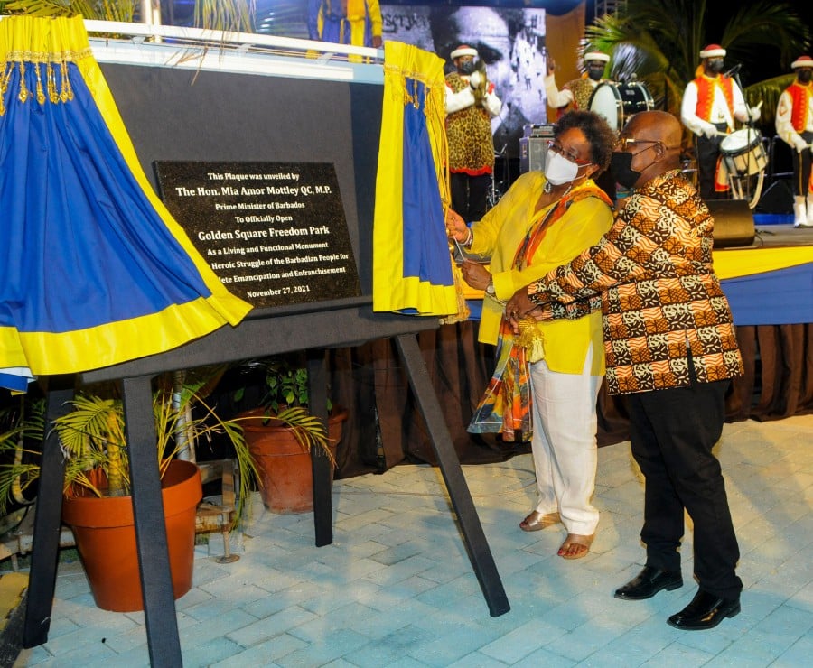 Barbados Prime Minister Mia Amor Mottley (2R) and Member of Parliament Trevor Prescott (R) unveil the plaque at the official opening of Golden Square Freedom Park in Bridgetown, Barbados on November 27, 2021. - Barbados is about to cut ties with the British monarchy, but the legacy of a sometimes brutal colonial past and the pandemic's impact on tourism pose major challenges for the Caribbean island as it becomes the world's newest republic.  - AFP pic