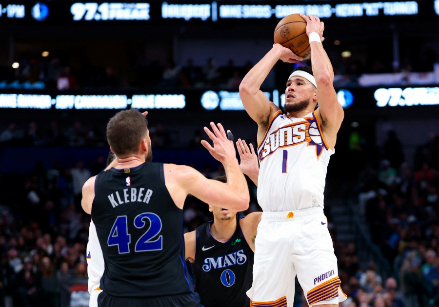 Phoenix Suns guard Devin Booker (1) shoots over Dallas Mavericks forward Maxi Kleber (42) during the second half at American Airlines Center. AFP PIC