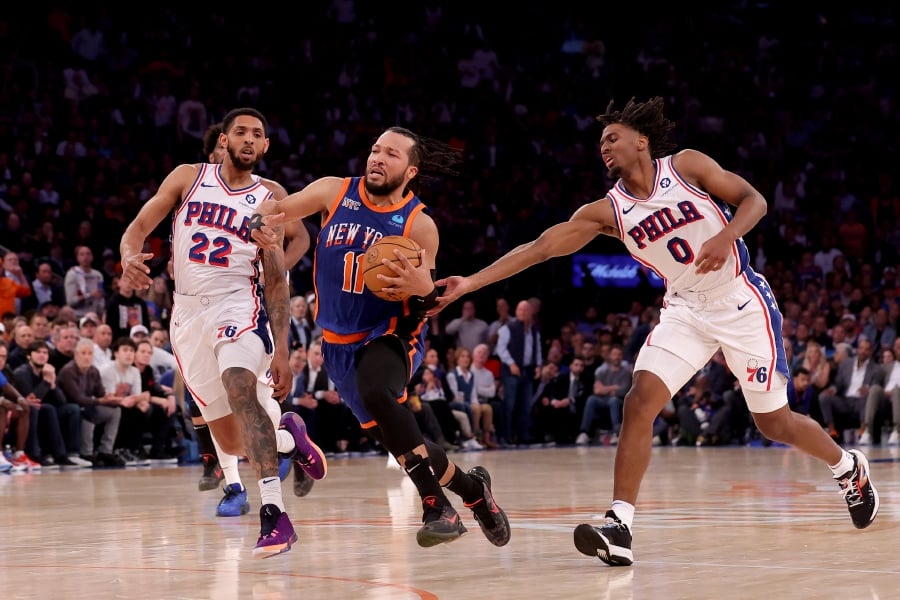 New York Knicks guard Jalen Brunson (11) drives to the basket against Philadelphia 76ers guards Cameron Payne (22) and Tyrese Maxey (0) during the fourth quarter of game 5 of the first round of the 2024 NBA playoffs at Madison Square Garden. (Brad Penner-USA TODAY Sports)
