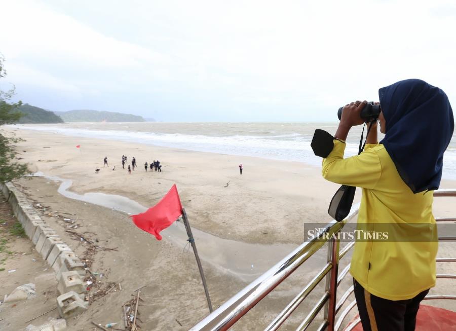 Red flags have also been raised along the beach to warn visitors on the potential danger. - NSTP/NUR AISYAH MAZALAN