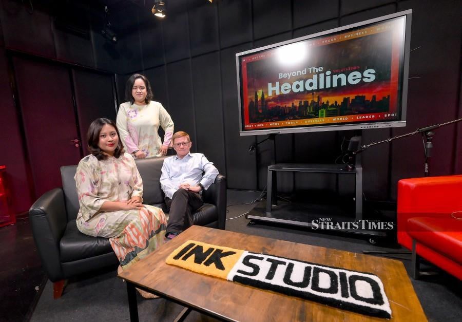 Professor and Provost for Research and Innovation at Malaysia University of Science and Technology, Geoffrey Williams (right seated) and News Editor, Hazween Hassan (middle) and Amalina Kamal (left seated) during Beyond The Headlines Recording EP27 at Studio Multimedia Balai Berita Bangsar, Kuala Lumpur. NSTP/RAIHANA MANSOR