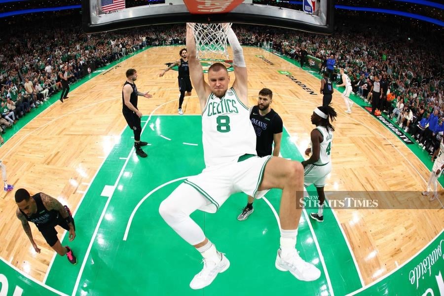 Kristaps Porzingis of the Boston Celtics dunks the ball during the first quarter against the Dallas Mavericks in Game One of the NBA Finals at TD Garden on Thursday in Boston, Massachusetts. AFP PIC 