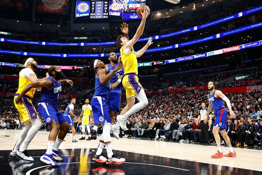 LOS ANGELES, CALIFORNIA - JANUARY 23: Austin Reaves #15 of the Los Angeles Lakers takes a shot against the LA Clippers in the second half at Crypto.com Arena on January 23, 2024 in Los Angeles, California. AFP PIC