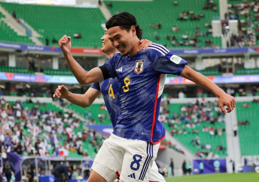 Two-goal Takumi Minamino admitted he was “surprised” by Vietnam after Asian Cup favourites Japan survived a scare in winning 4-2 to open their campaign in Qatar.- BERNAMA pic