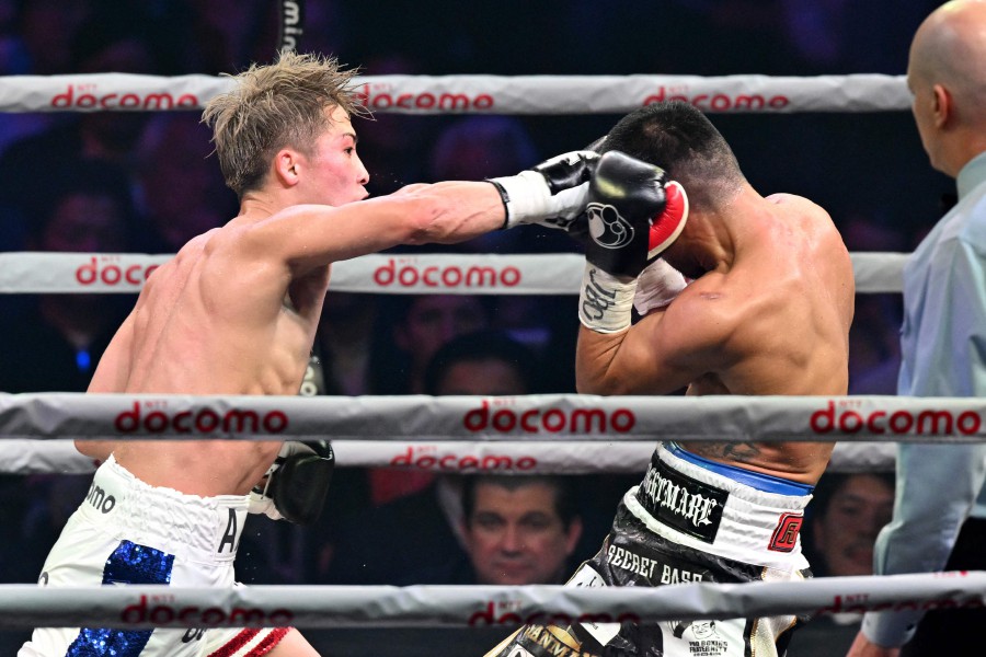 Japan's WBC and WBO super bantamweight champion Naoya Inoue (Left) fights against Philippines' WBA and IBF super bantamweight champion Marlon Tapales during their four-belt world super bantamweight title unification match at Tokyo's Ariake Arena. - AFP pic