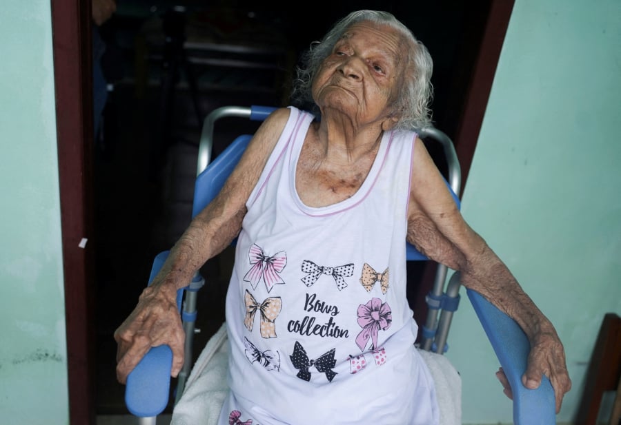 Deolira Gliceria Pedro da Silva, 119, sits in her house in Itaperuna, Rio de Janeiro state, Brazil. (REUTERS/Ricardo Moraes)