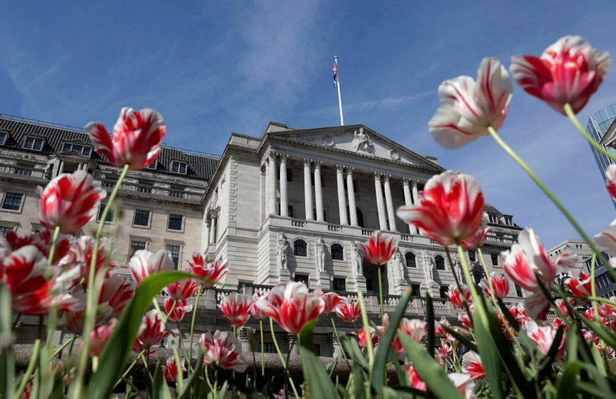 The Bank of England building is seen surrounded by flowers in London, Britain, May 8, 2024. REUTERS