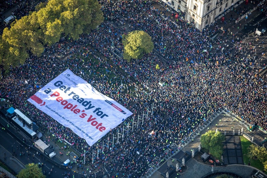 As lawmakers huddled inside the House of Commons on Saturday to debate Prime Minister Boris Johnson’s Brexit deal, hundreds of thousands of protesters gathered outside the Palace of Westminster to demand that voters be given the final say on Brexit. -- Reuters photo