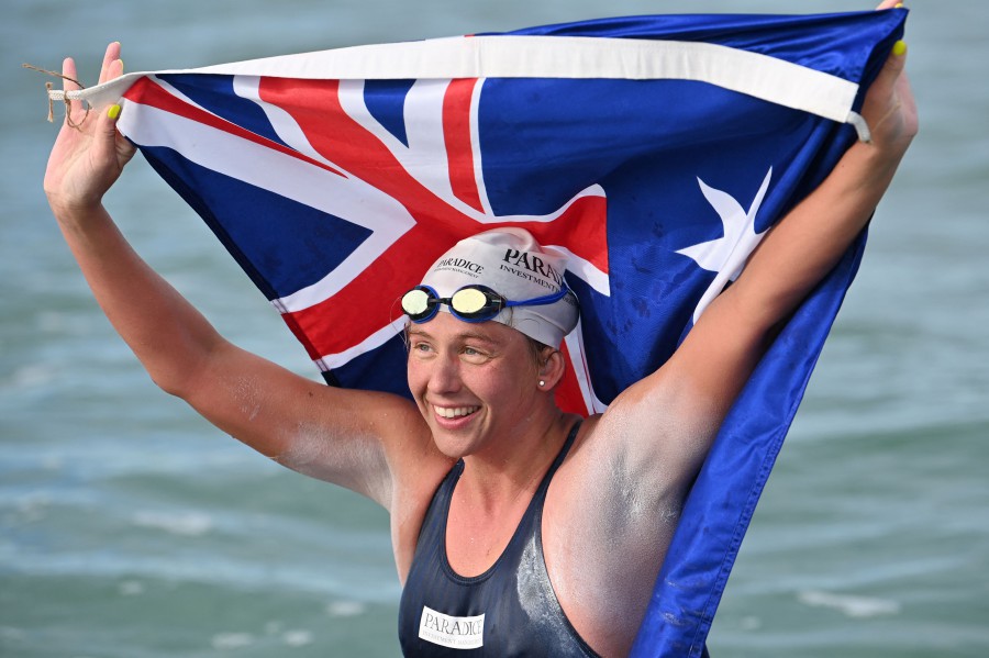 Australian marathon swimmer Chloe McCardel celebrates as she returns to her pilot boat following her 10-hour swim across the English Channel for a world record-breaking 44th time, after landing on Wissant Beach, France on October 13, 2021. - AFP pic