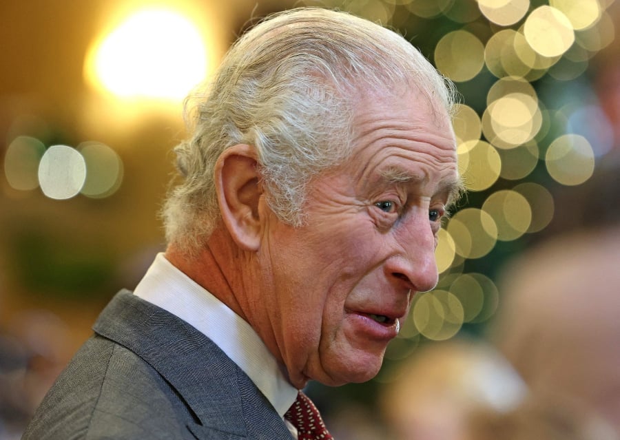 Britain's King Charles III reacts as he meets with guests during a 75th birthday party for him, hosted by the Prince's Foundation, at Highgrove House in Tetbury, western England. (Photo by Chris Jackson / POOL / AFP)