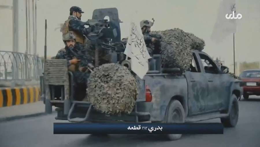 A video grab taken from Afghan TV RTA shows propaganda images of Taliban's Badri 313 Special Forces patrolling streets in an unidentified location in Afghanistan. (Photo by - / RTA TV / AFP)
