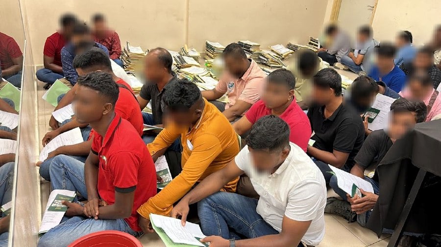  27 Bangladeshi men, along with one local woman, representing employers of a local company, were detained by the Federal Territory Immigration Department (JIM WPKL), yesterday. - Pic courtesy of Immigration Department