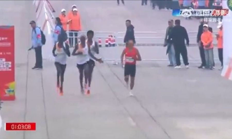 The top three in Sunday’s Beijing half marathon have been stripped of their medals, organisers said, following an investigation into the finish that saw China’s He Jie controversially win. - Screengrab from @whyyoutouzhele/X