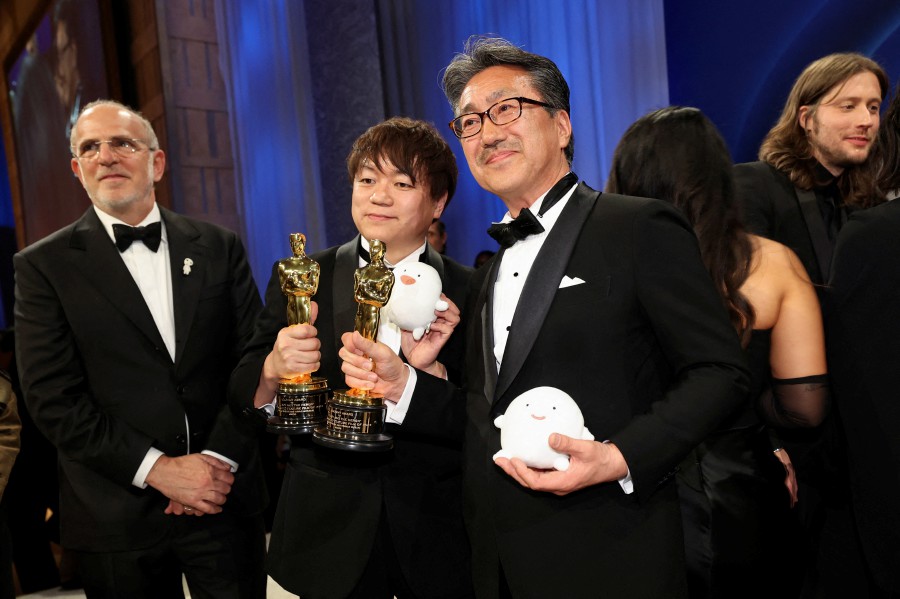 Kiyofumi Nakajima and Kenichi Yoda pose with the Oscar for Best Animated Feature Film for "The Boy and the Heron" on behalf of Director Hayao Miyazaki and producer Toshio Suzuki, at the Governors Ball following the Oscars show at the 96th Academy Awards in Hollywood, Los Angeles, California. - REUTERS PIC