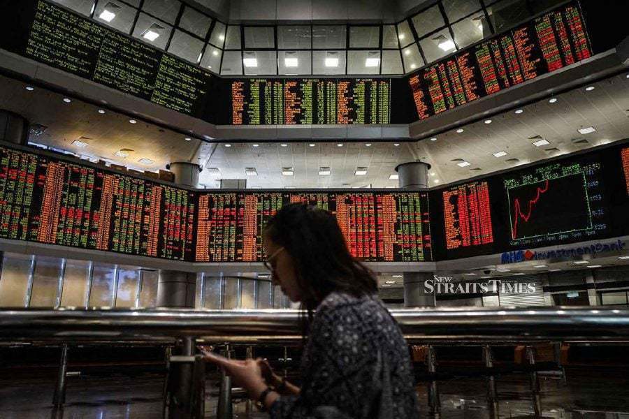 Bursa Malaysia remained in negative territory at midday as investors exercised caution ahead of the announcement of the overnight policy rate (OPR) and the outcome of China's National People’s Congress.