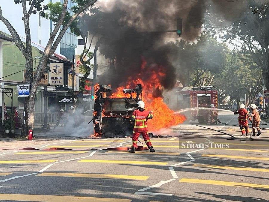 A Rapid Penang bus caught fire near the Pulau Tikus police station here this afternoon. - Pic courtesy of Fire and Rescue Dept
