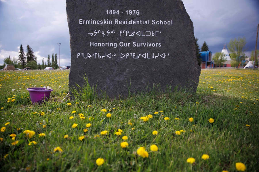 A monument honoring survivors of the Ermineskin Indian Residential School is seen near the site where the school stood, on Ermineskin 138 reserve in Maskwacis, Alberta, June 7, 2022. (Photo by Cole Burston / AFP)