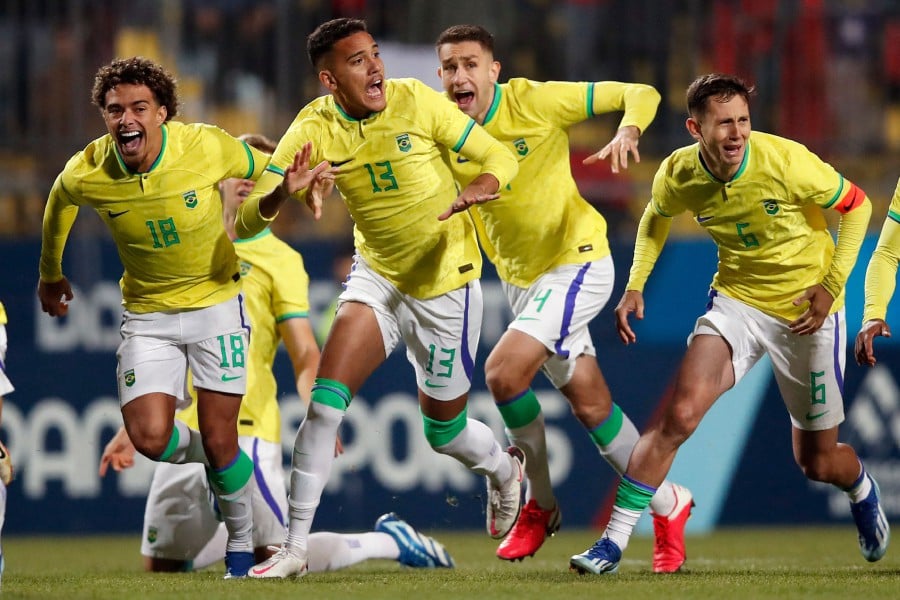 Players of Brazil celebrate after defeating Chile and winning the gold medal during the men's team gold medal football match between Chile and Brazil at the Pan American Games Santiago 2023, in the Sausalito stadium, Viña del Mar, Chile. - AFP pic