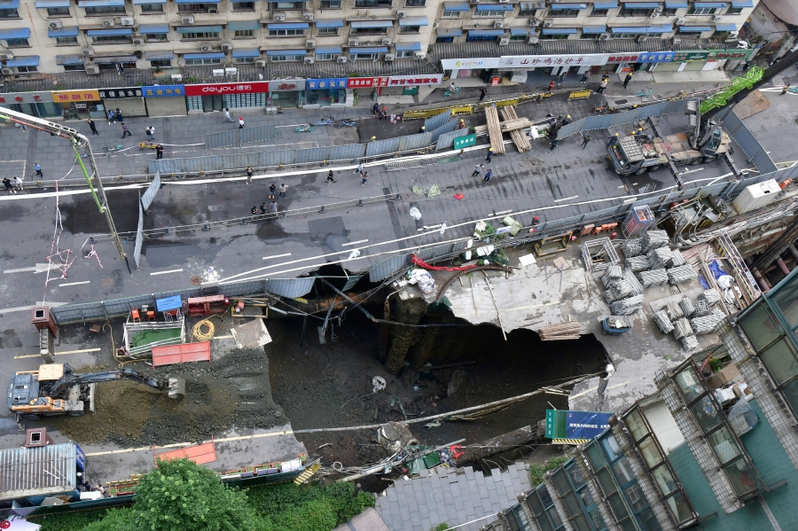A view of a sinkhole at a road section where a subway construction site collapsed due to burst water pipes, in Chengdu, Sichuan province, China. (China Daily via REUTERS)