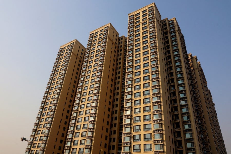 FILE PHOTO: A general view of residential buildings developed by China Evergrande Group, after a court ordered the liquidation of the property developer, in Beijing, China January 29, 2024. REUTERS/Florence Lo/File Photo