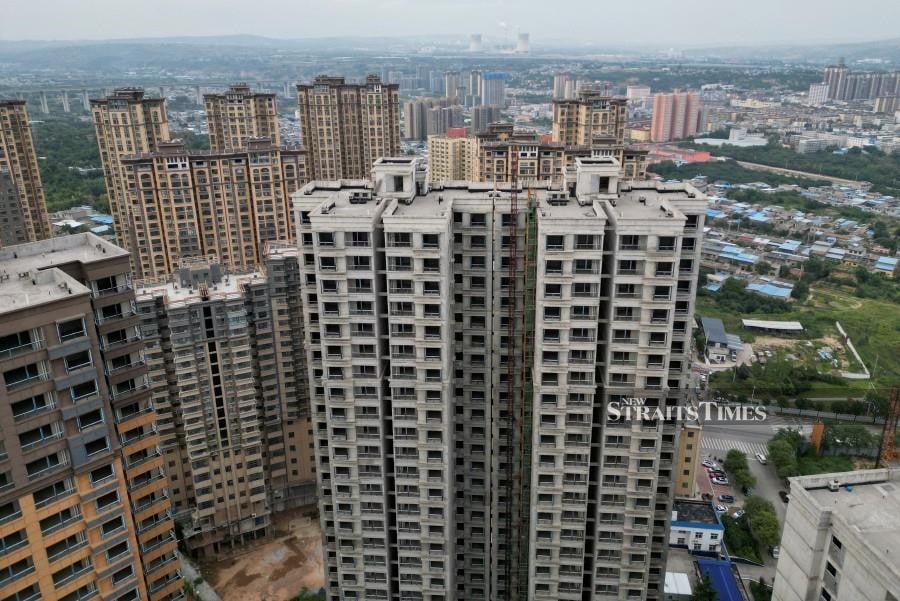 An aerial view shows unfinished residential buildings complex in China. REUTERS/Xiaoyu Yin/File Photo