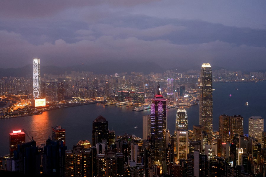 FILE PHOTO: An evening view of the financial Central district and Victoria Harbour in Hong Kong, China, May 9, 2023. REUTERS/Tyrone Siu/File Photo