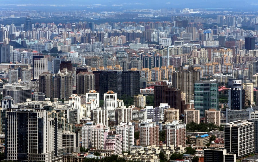 FILE PHOTO: Buildings are seen in Beijing, July 3, 2013. REUTERS/Jason Lee/File Photo
