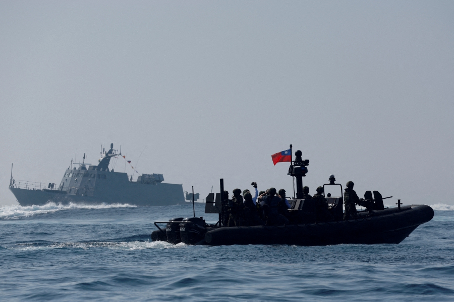 (FILE PHOTO) Members of Taiwan's Navy and media onboard a special operation boat navigate near a Kuang Hua VI-class missile boat, during a drill part of a demonstration for the media. (REUTERS/Carlos Garcia Rawlins/File Photo)