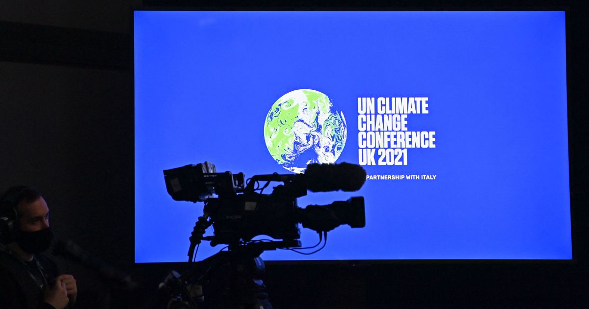 COP26 draft urges boost to emissions cutting goals by 2022