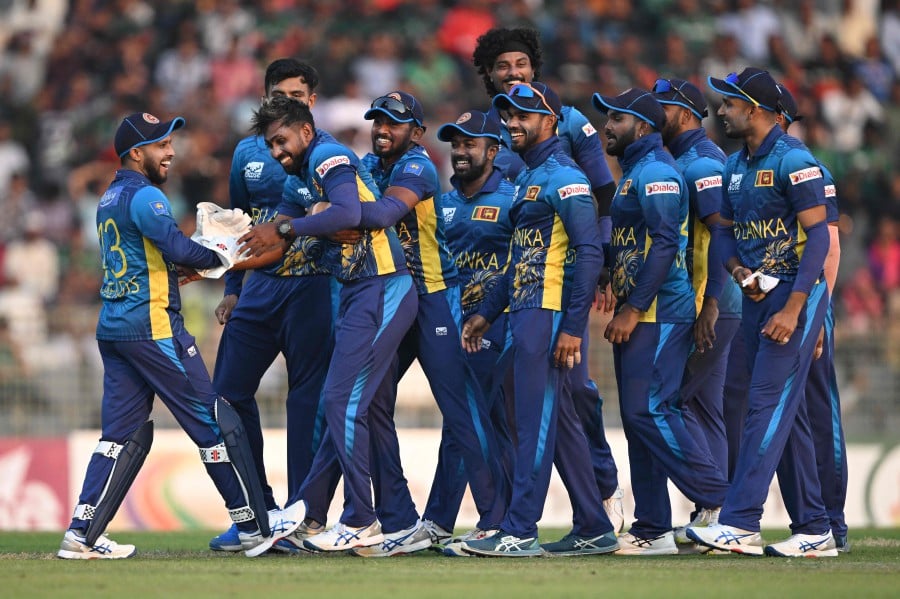 Sri Lanka's Nuwan Thushara (3L) celebrates with teammates after the dismissal of Bangladesh's captain Najmul Hossain Shanto, Thushara's third wicket in the match, during the third and last Twenty20 international cricket match between Bangladesh and Sri Lanka at the Sylhet International Cricket Stadium in Sylhet on March 9, 2024. AFP PIC