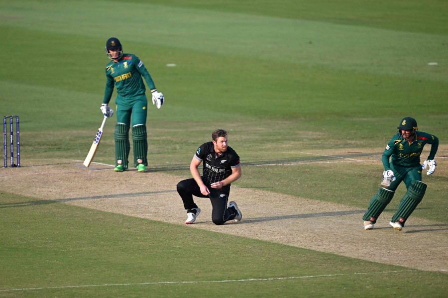 South Africa's Quinton de Kock (right) and Rassie van der Dussen prepare to run between the wickets as New Zealand's James Neesham (centre) watches during the 2023 ICC Men's Cricket World Cup one-day international (ODI) match between New Zealand and South Africa at the Maharashtra Cricket Association Stadium in Pune. - AFP pic